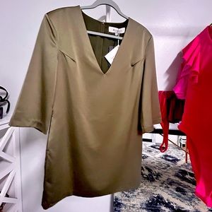 Beautiful olive tone green dress. Size large but runs small.  Above knee.
